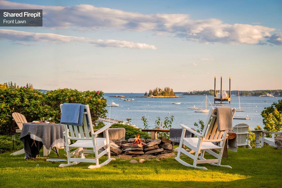 Adirondack chairs on the lawn overlooking Boothbay Harbor