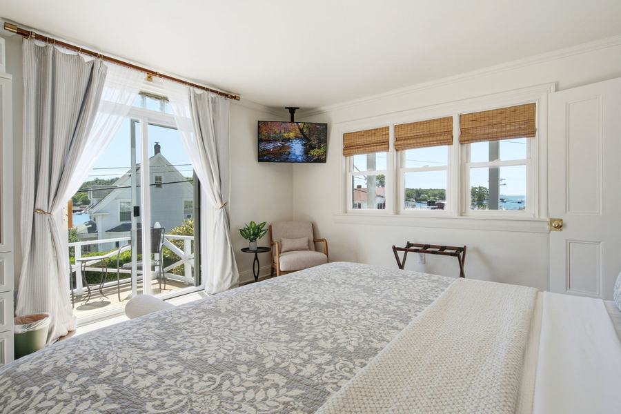 First-floor GL-1 king suite at Greenleaf Inn with private deck access and Boothbay Harbor views.